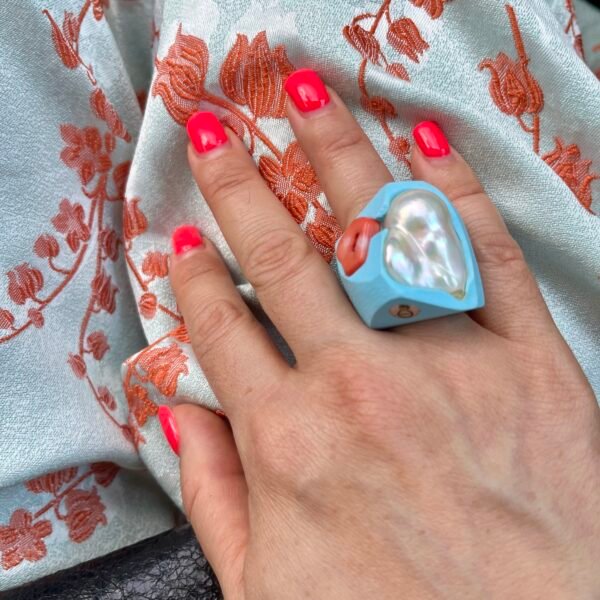 white-pearl-ring-on-hand