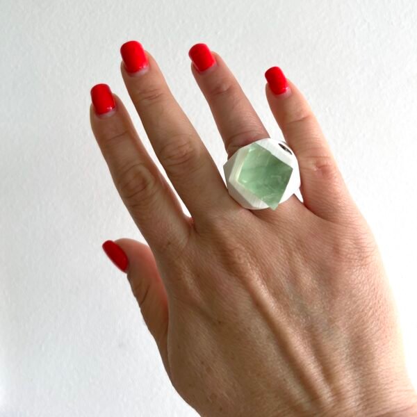 raw fluorite ring on hand