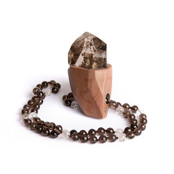 Large raw Smoky Quartz pendant with ceramic and silver detailing.